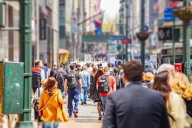 New York, streets. High buildings and crowd walking