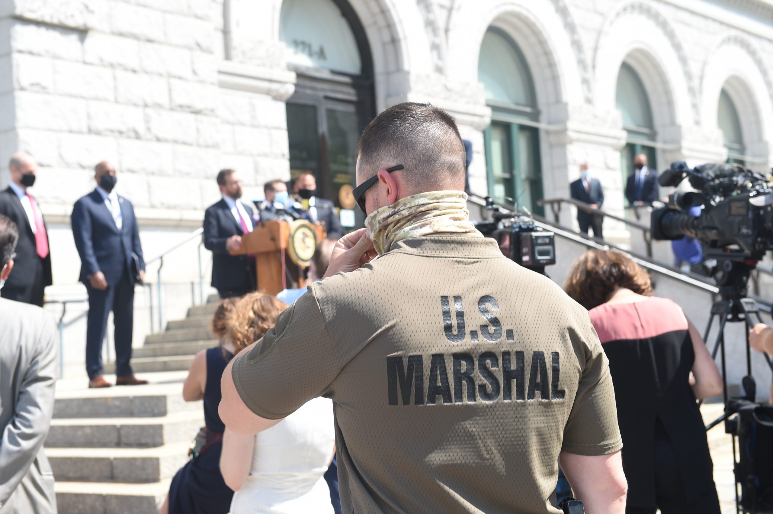 U.S. Marshals providing security for the outdoor press conference