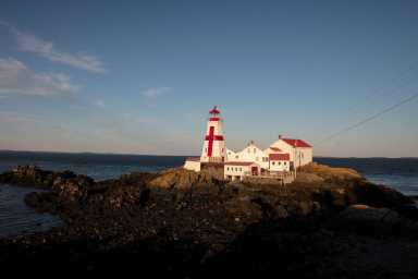The Head Harbour Lightstation is seen in the evening twilight on Campobello Island