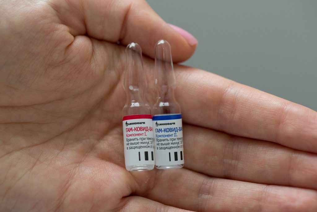 A photo shows an employee demonstrating vials with vaccine against the coronavirus disease (COVID-19) near Moscow