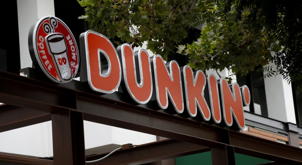 FILE PHOTO: The sign of a Dunkin’ store, the first since a rebranding by the Dunkin’ Donuts chain, is pictured ahead of its opening in Pasadena