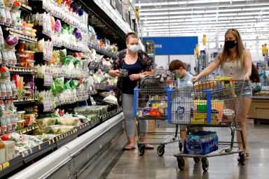 FILE PHOTO: Shoppers are seen wearing masks while shopping at a Walmart store in Bradford, Pennsylvania