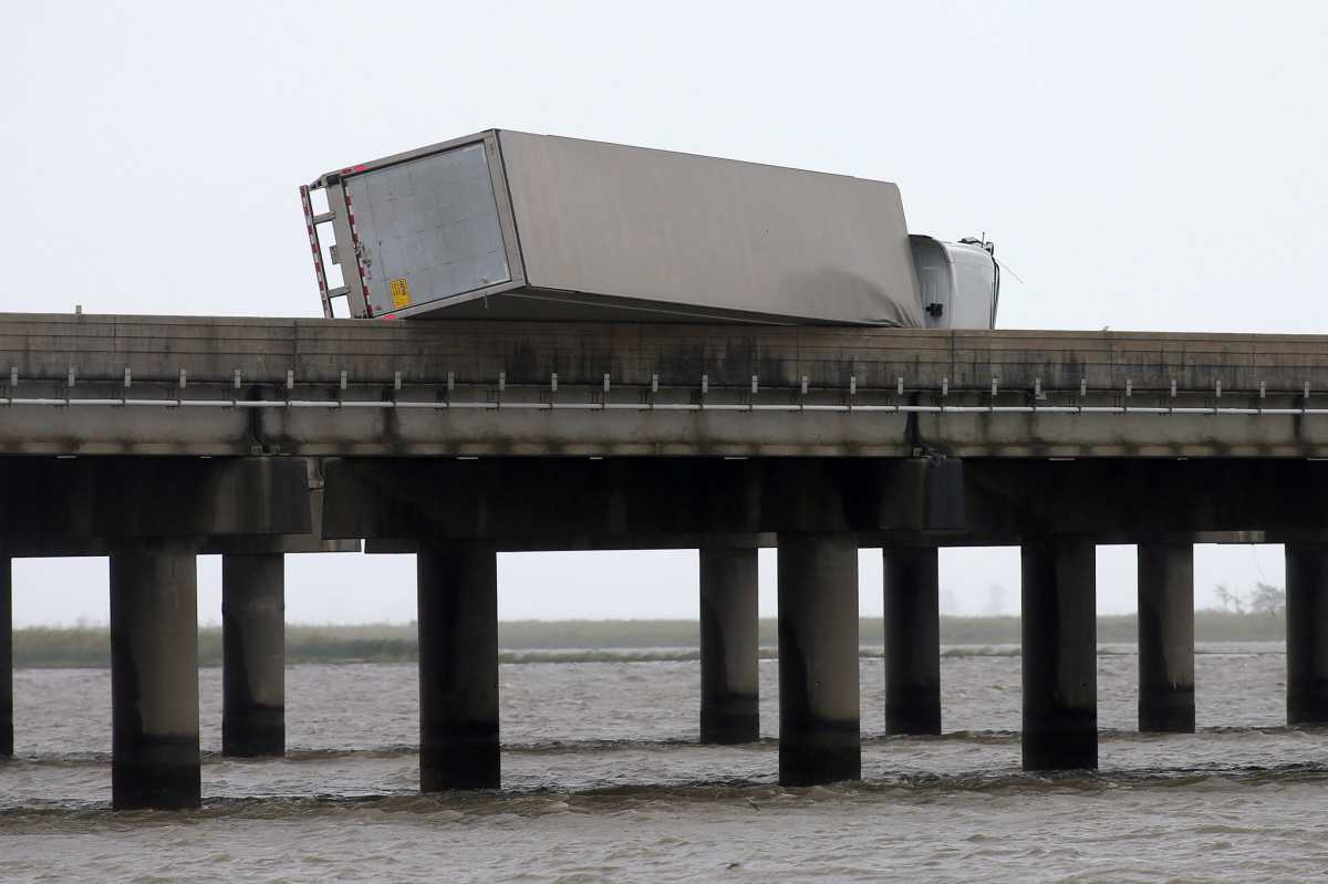 A flipped over trailer is pictured on I-10 East during Hurricane Sally in Mobile