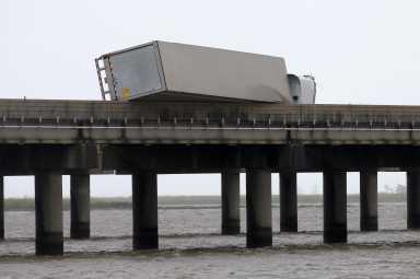 A flipped over trailer is pictured on I-10 East during Hurricane Sally in Mobile