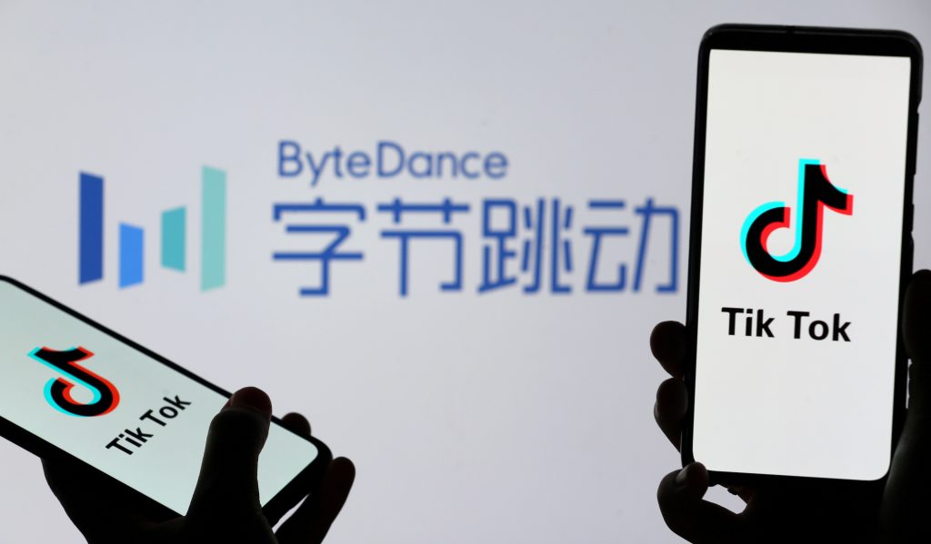 FILE PHOTO: Tik Tok logos are seen on smartphones in front of displayed ByteDance logo in this illustration