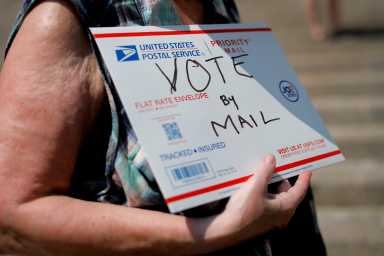 FILE PHOTO: FILE PHOTO: U.S. Postal Service (USPS) workers rally to end mail delays and for the firing of U.S. Postmaster General Louis DeJoy in New York
