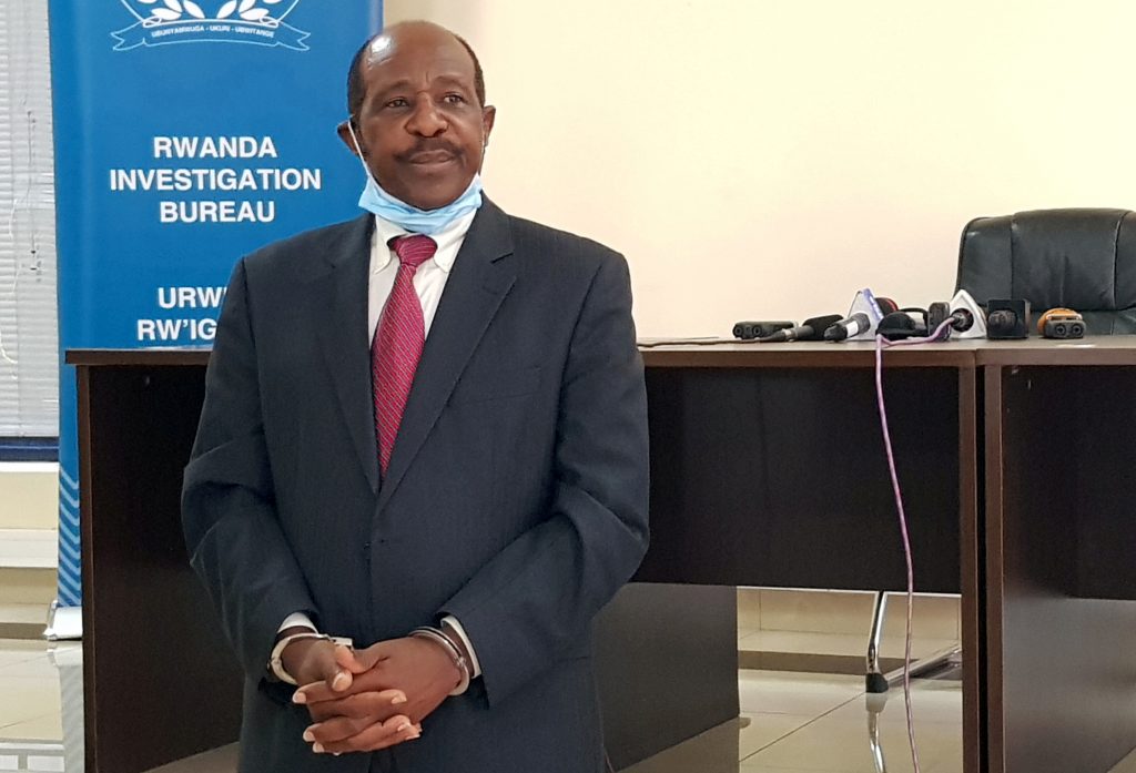 FILE PHOTO: Rusesabagina is detained and paraded in front of media in handcuffs in Kigali