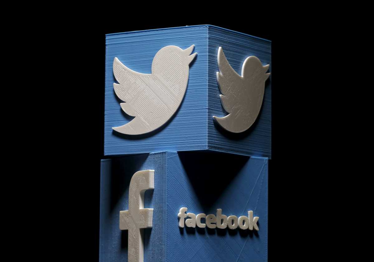 3D-printed Facebook and Twitter logos are seen in this picture illustration made in Zenica