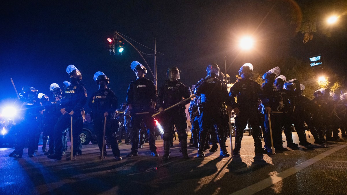 Louisville Police Department block an intersection after curfew, a day after a grand jury decided not to bring homicide charges against police officers involved in the fatal shooting of Breonna Taylor in her apartment, in Louisville