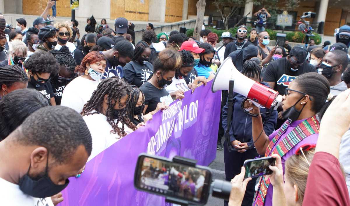 Protesters march through downtown Louisville