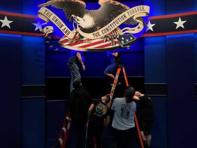 Workers prepare for the first presidential debate between U.S. President Trump and Democratic nominee Biden in Cleveland, Ohio