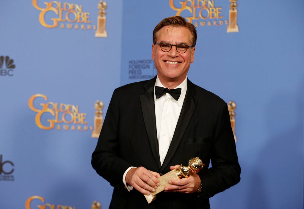 FILE PHOTO: Aaron Sorkin poses with the award for Best Screenplay – Motion Picture for “Steve Jobs” backstage at the 73rd Golden Globe Awards in Beverly Hills