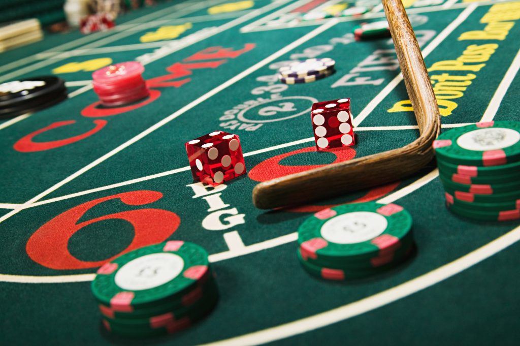 Croupier stick clearing craps table