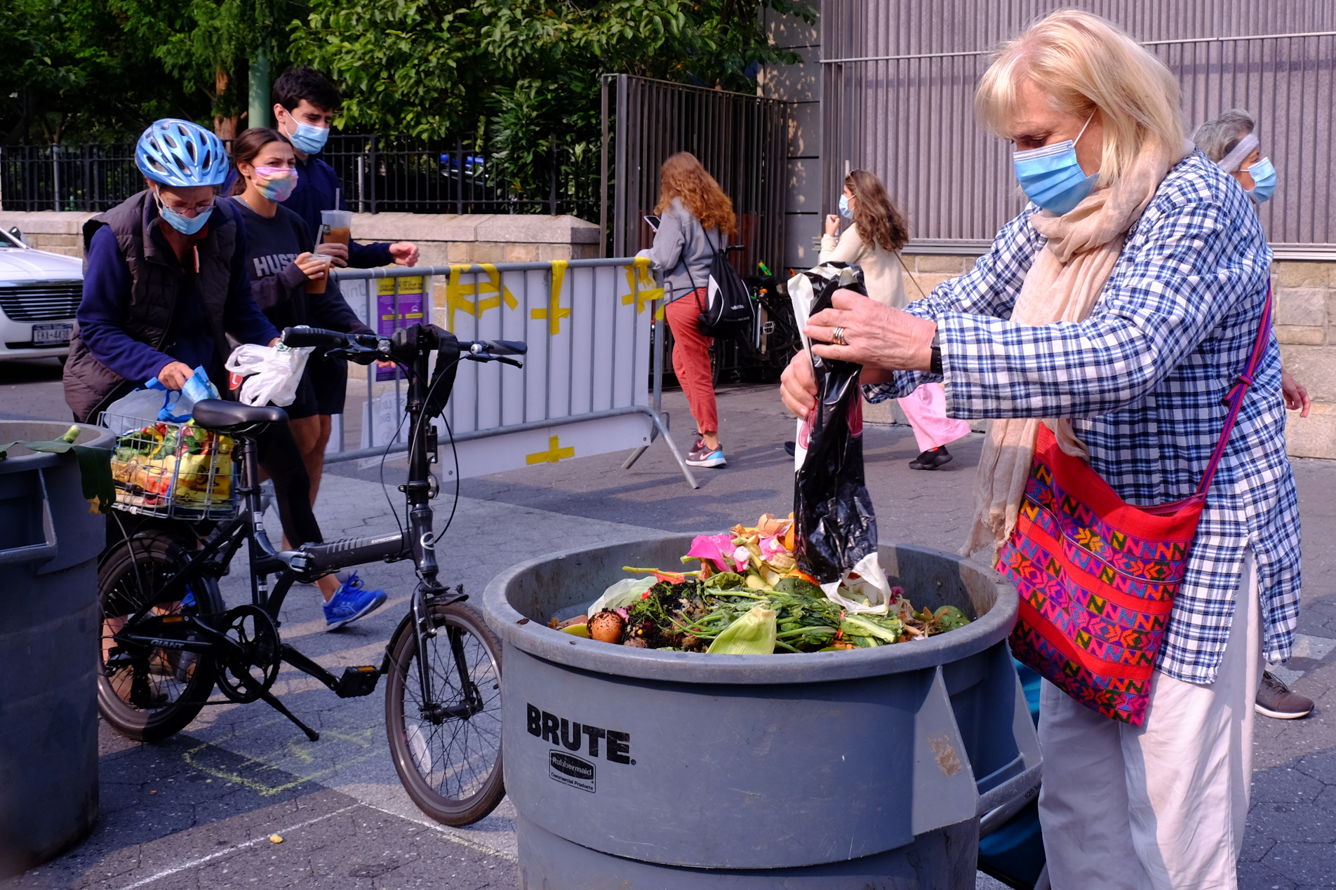 Compost is brought to drop-off by bicycle, foot, and shopping cart.