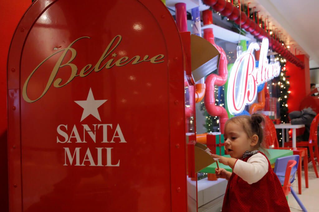 A child mails a letter to Santa at Macy’s Herald Square in Manhattan, New York City
