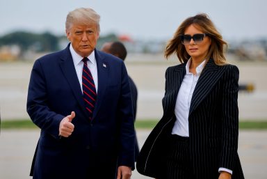 FILE PHOTO: U.S. President Donald Trump walks with first lady Melania Trump at Cleveland Hopkins International Airport in Cleveland