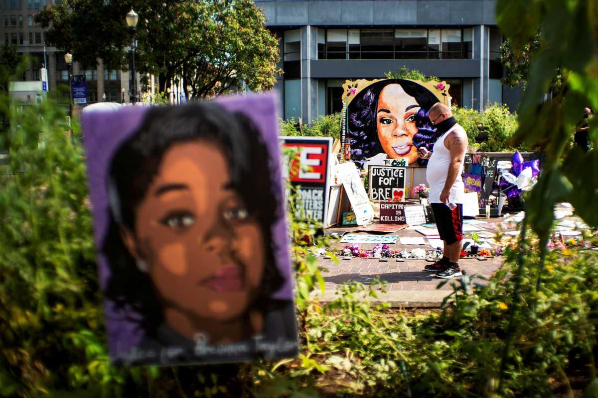 FILE PHOTO: People react after a decision in the criminal case against police officers involved in the death of Breonna Taylor