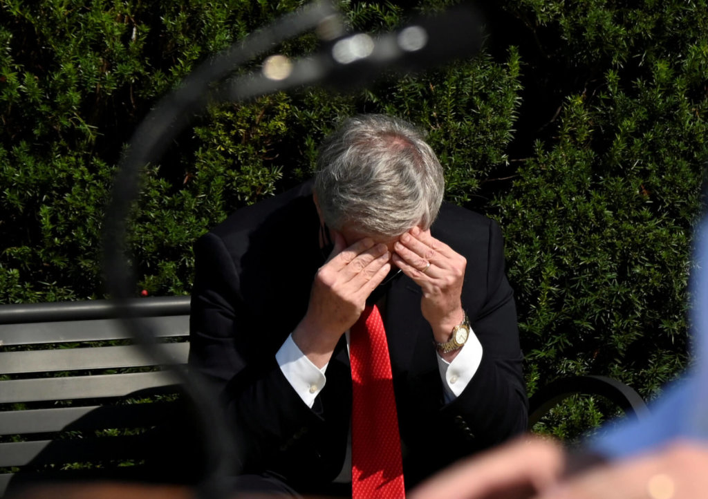 FILE PHOTO: White House Chief of Staff Mark Meadows rubs his head as U.S. Navy Commander Dr. Sean Conley speaks about U.S. President Donald Trump’s health, in Bethesda