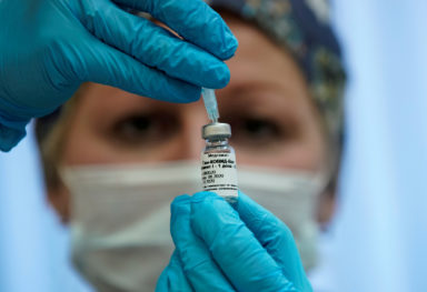 FILE PHOTO: A nurse prepares Russia’s “Sputnik-V” vaccine against the coronavirus disease (COVID-19) for inoculation in a post-registration trials stage at a clinic in Moscow