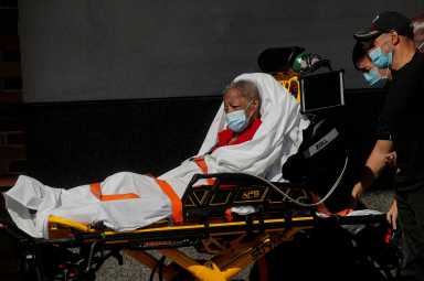 FILE PHOTO: A patient arrives at the Emergency entrance to Maimonides Medical Center in the Borough Park neighborhood of Brooklyn, New York