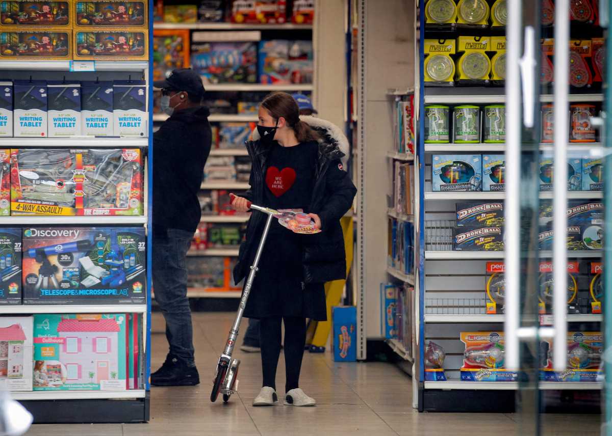 FILE PHOTO: A young Ultra-Orthodox Jewish girl shops in a toy store, during the outbreak of coronavirus disease (COVID-19) in the Borough Park section of Brooklyn, New York