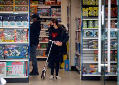 FILE PHOTO: A young Ultra-Orthodox Jewish girl shops in a toy store, during the outbreak of coronavirus disease (COVID-19) in the Borough Park section of Brooklyn, New York