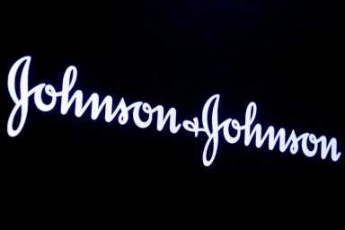 The company logo for Johnson & Johnson is displayed on a screen to celebrate the 75th anniversary of the company’s listing at the NYSE in New York