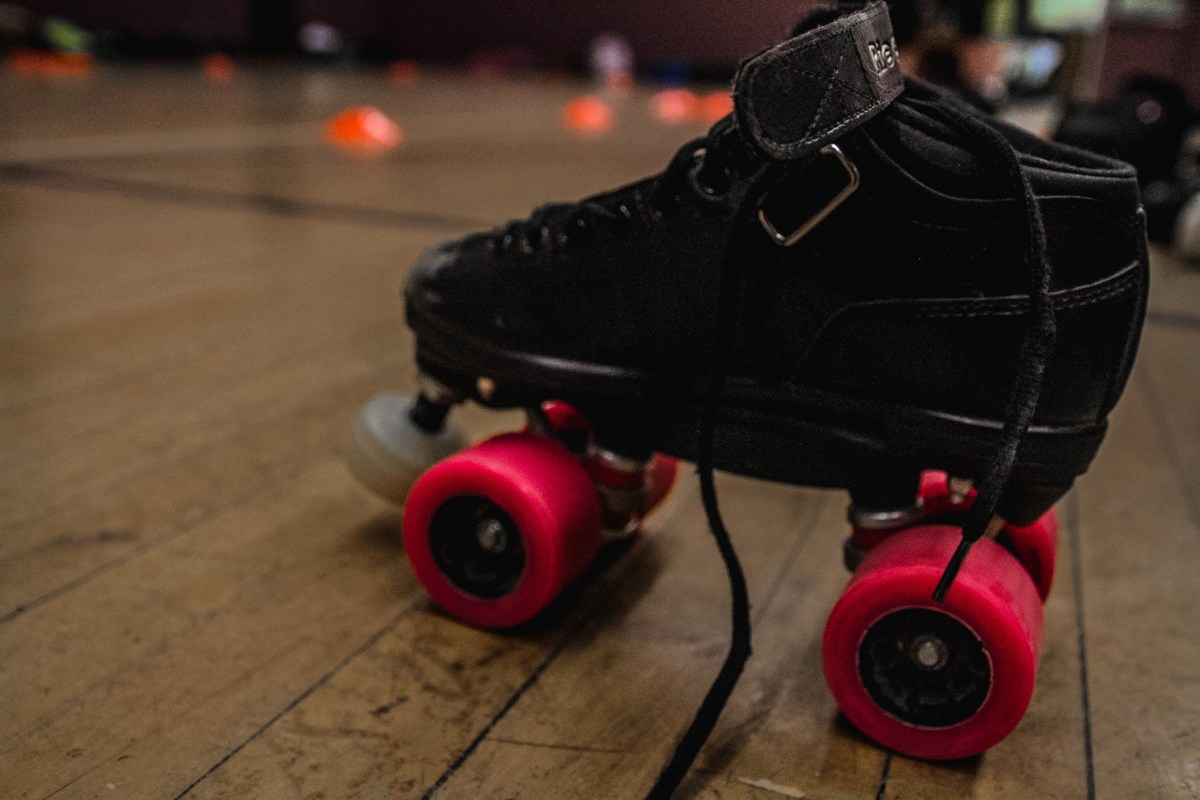 Pink wheeled roller skate