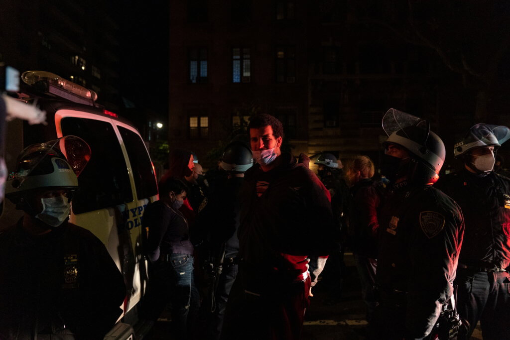 Police officers stand next to detained demonstrators near Washington Square park the day after Election Day in Manhattan, New York City