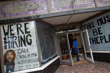 FILE PHOTO: A new business advertises for workers as it prepares to open up during the outbreak of the coronavirus disease in California,