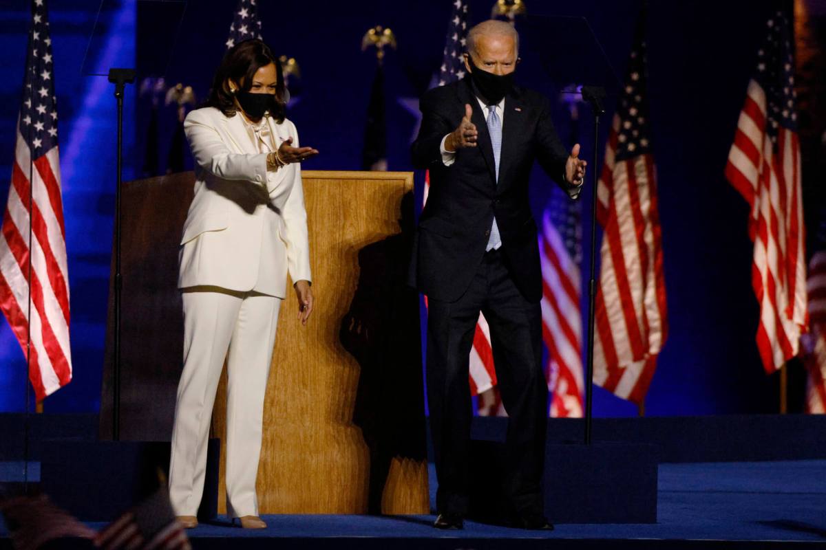 Democratic 2020 U.S. presidential nominee Joe Biden joins vice presidential nominee Kamala Harris onstage in Wilmington