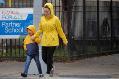 A student exits a school as the spread of coronavirus disease (COVID-19) continues, in Brooklyn, New York