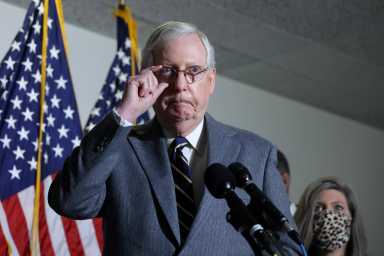 U.S. Senate Majority Leader McConnell arrives for a news conference on Capitol Hill in Washington