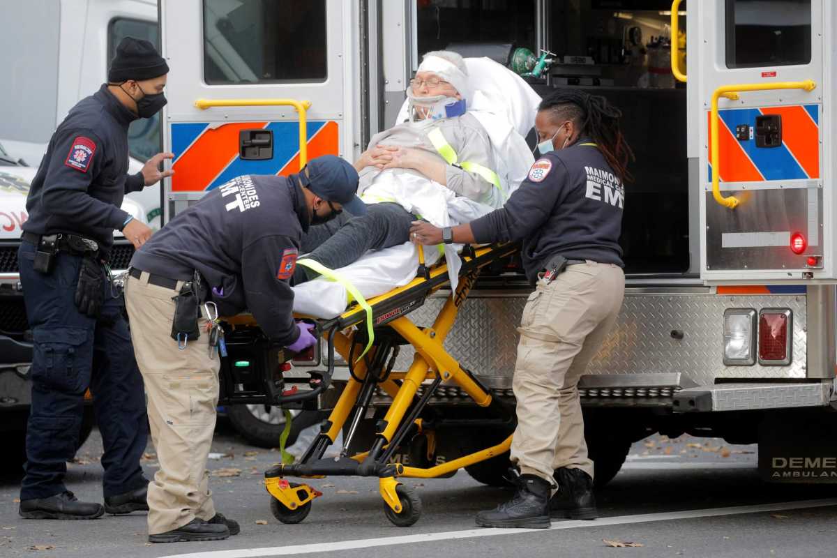 A patient arrives outside Maimonides Medical Center in Brooklyn