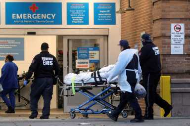 A patient arrives outside Maimonides Medical Center, as the spread of the coronavirus disease (COVID-19) continues, in Brooklyn, New York