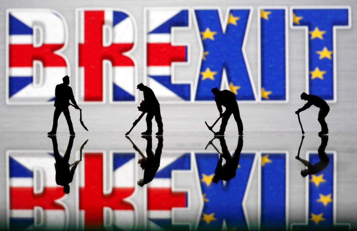 Small toy figures are seen in front of a Brexit logo in this illustration picture