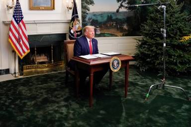 U.S. President Donald Trump  participates in a Thanksgiving video teleconference with members of the military forces at the White House in Washington