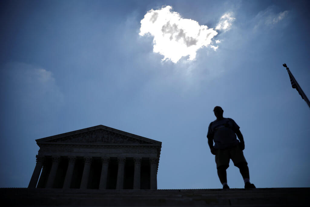 A man stands outside the U.S. Supreme Court in Washington