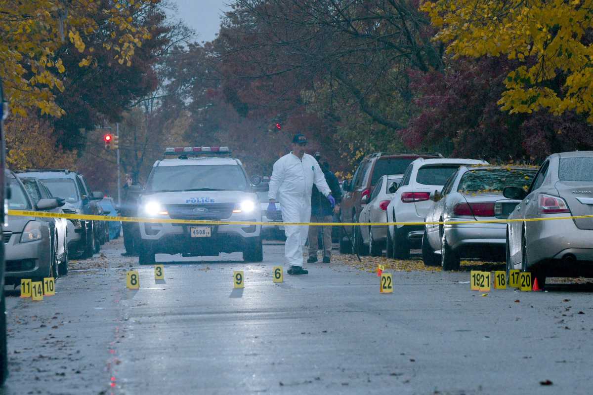 Detectives from the 105 Precinct probe a fatal shooting at 121-35 235 Street