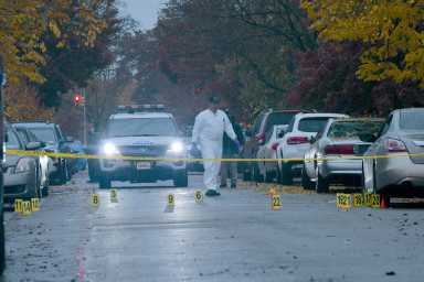 Detectives from the 105 Precinct probe a fatal shooting at 121-35 235 Street