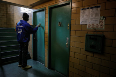 A worker delivers donated food at the Queensbridge Houses, a NYCHA public housing complex, during the outbreak of the coronavirus disease (COVID-19) in Queens, New York