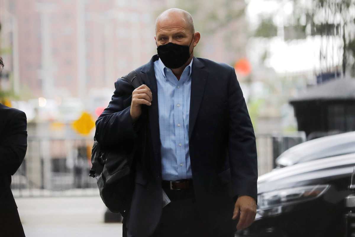 Michael Mulgrew, President of the United Federation of Teachers (UFT), walks after exiting City Hall in New York City