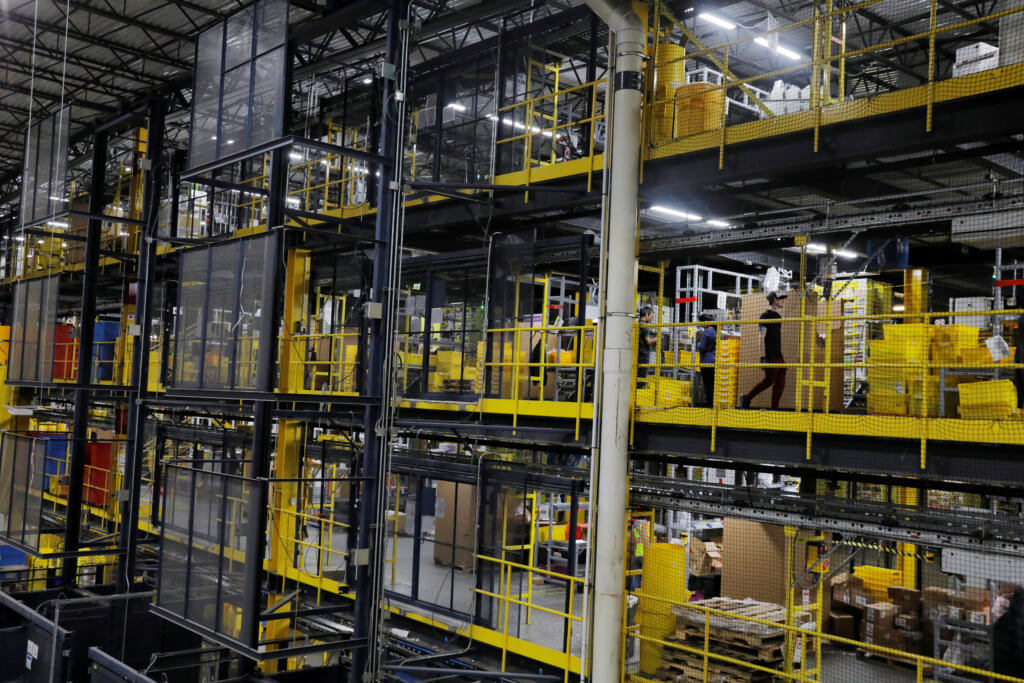 Amazon workers perform their jobs inside of an Amazon fulfillment center on Cyber Monday in Robbinsville, New Jersey