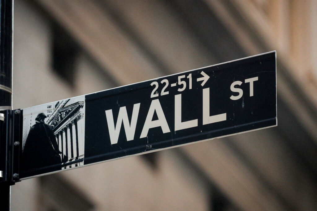FILE PHOTO: A Wall St. sign is seen near the NYSE in the financial district in New York