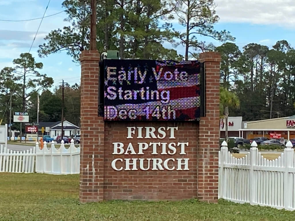 FILE PHOTO: View of a digital sign advertising early voting for the Jan. 5, 2021 Senate runoffs in Georgia at the First Baptist Church, in Nahunta