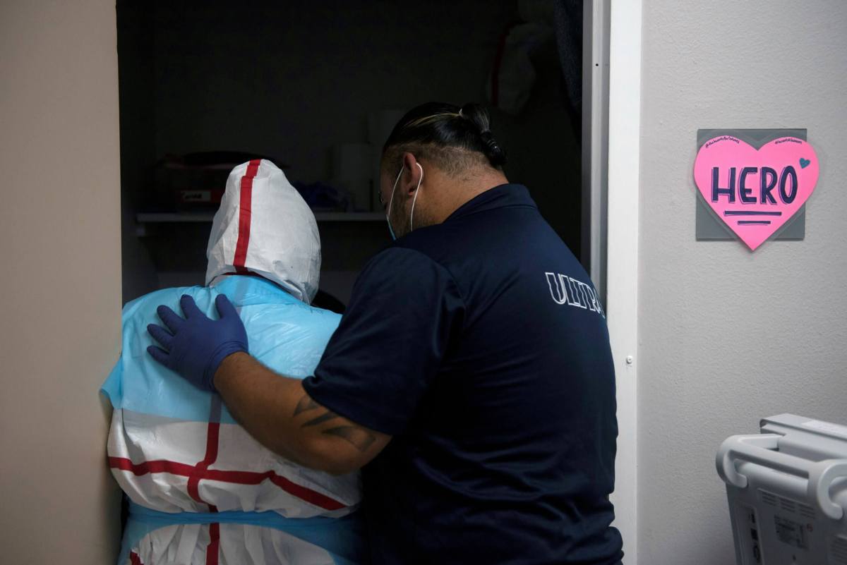 FILE PHOTO: Healthcare personnel work inside a COVID-19 unit in Houston