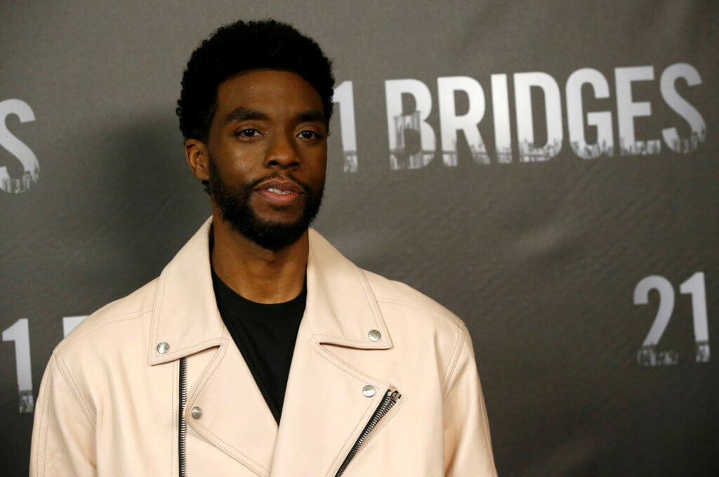 FILE PHOTO: Cast member Boseman poses at a photo call for the movie “21 Bridges” in Los Angeles