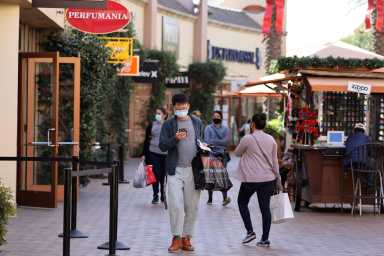 FILE PHOTO: People shop at the Citadel Outlet mall, as the global outbreak of the coronavirus disease (COVID-19) continues, in Commerce
