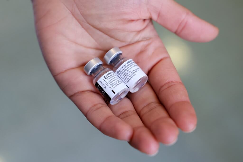 Walgreens Pharmacist Jessica Sahni holds the coronavirus disease (COVID-19) vaccine at The New Jewish Home in the Manhattan borough of New York City