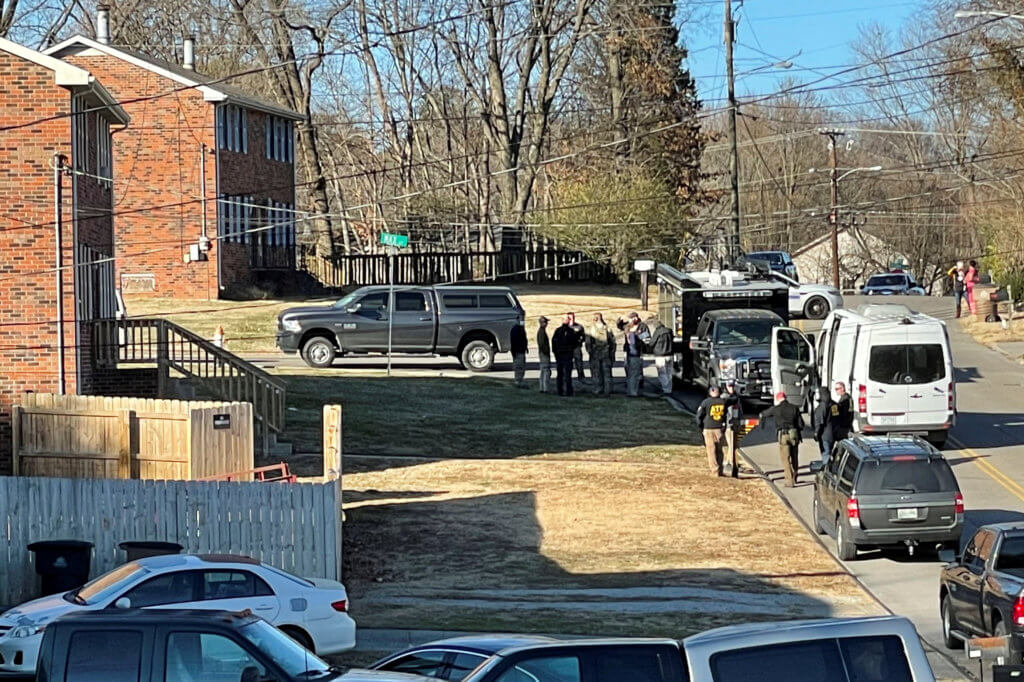 FILE PHOTO: Law enforcement officers gather to investigate information arising the day after a downtown Nashville explosion, outside a duplex house in Antioch